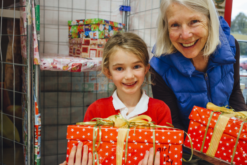 Person giving presents 