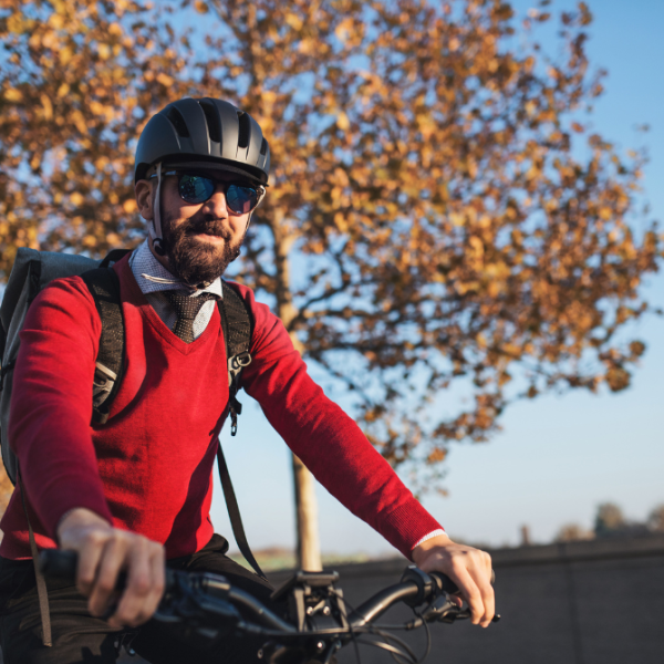 Person in red jumper on bike
